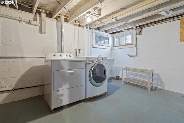 clothes washing area featuring laundry area and independent washer and dryer