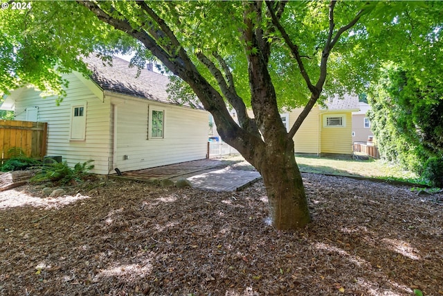 exterior space with fence and a patio