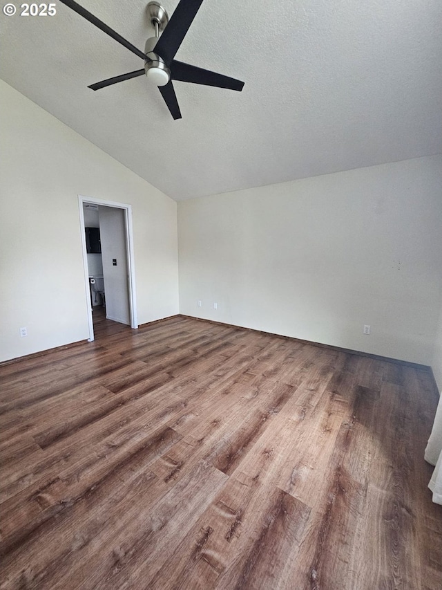 5740 SE Golden Rd, Hillsboro, OR 97123 - spare room with vaulted ceiling, a ceiling fan, wood finished floors, and a textured ceiling