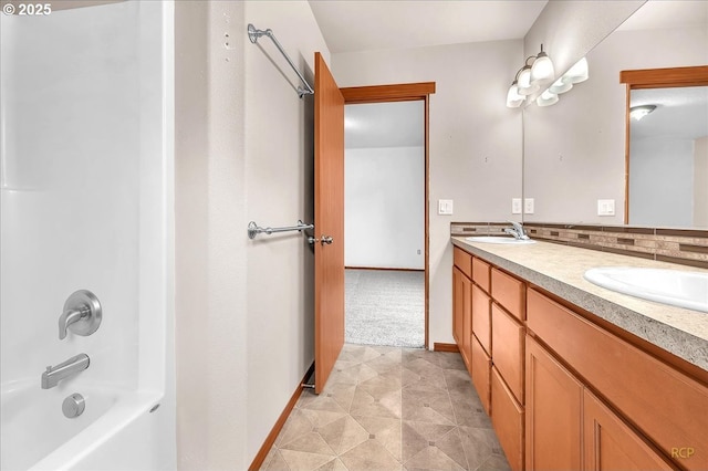 full bathroom with backsplash, a sink, shower / bathing tub combination, and double vanity