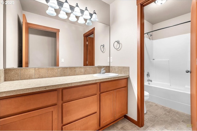 full bathroom featuring toilet, shower / tub combination, and vanity