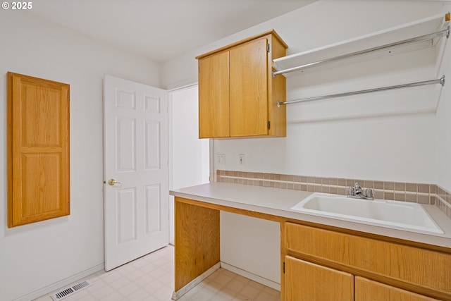 1939 NE Harewood Pl, Hillsboro, OR 97124 - laundry room with light flooring and a sink