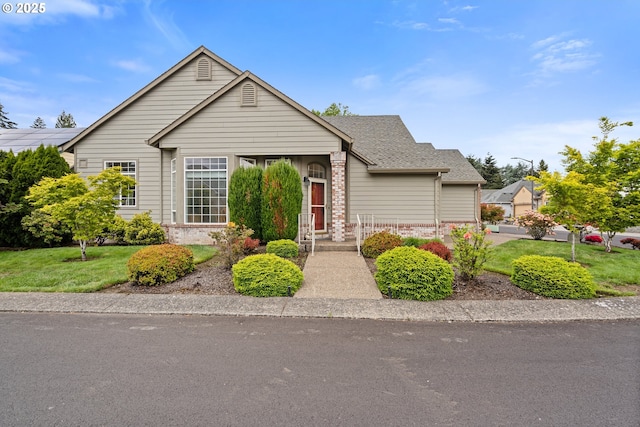 1939 NE Harewood Pl, Hillsboro, OR 97124 - view of front of house featuring brick siding, a front lawn, and roof with shingles