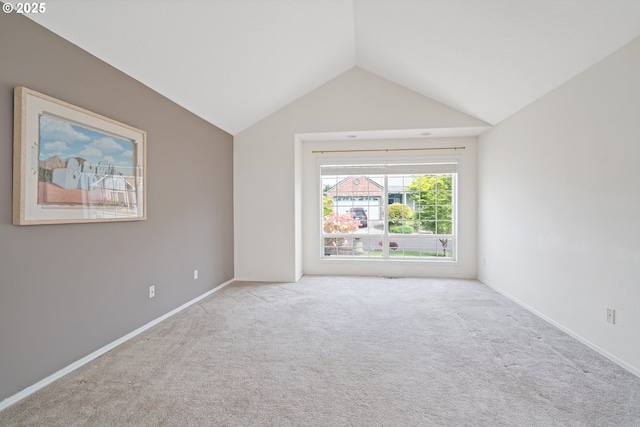 1939 NE Harewood Pl, Hillsboro, OR 97124 - empty room featuring lofted ceiling, carpet flooring, and baseboards