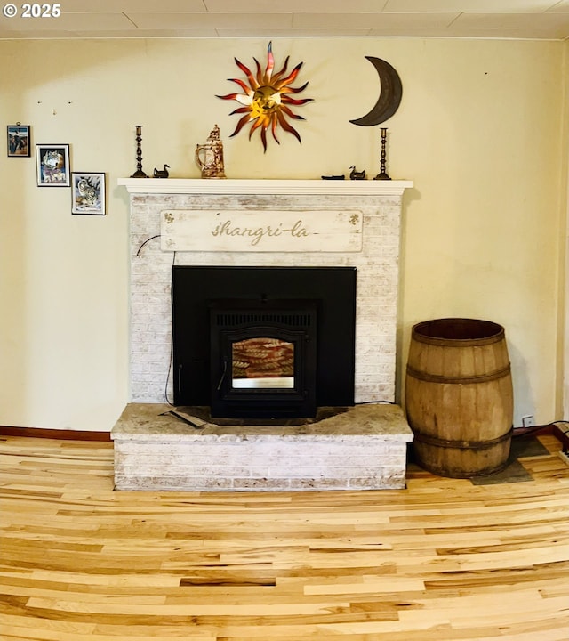 42799 Leaburg Dr, Walterville, OR 97489 - details with baseboards, a brick fireplace, and wood finished floors