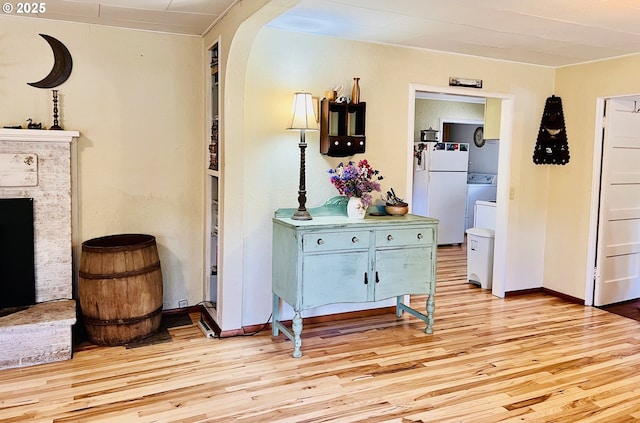 42799 Leaburg Dr, Walterville, OR 97489 - hall featuring baseboards, light wood-type flooring, and washer / clothes dryer
