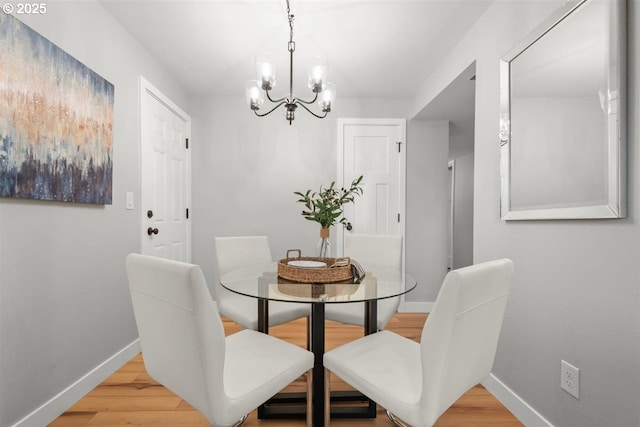 2450 Eddy Ave NE, Salem, OR 97301 - dining room featuring baseboards, a chandelier, and light wood-style floors