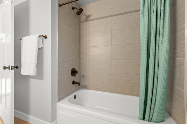 2450 Eddy Ave NE, Salem, OR 97301 - bathroom with shower / tub combo with curtain and baseboards