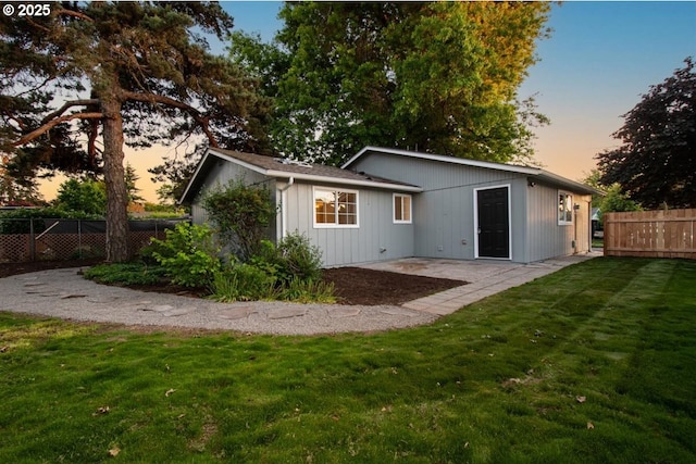 2450 Eddy Ave NE, Salem, OR 97301 - back of house at dusk featuring a patio