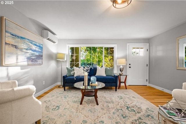 2450 Eddy Ave NE, Salem, OR 97301 - living area featuring a wall mounted air conditioner, baseboards, and wood finished floors