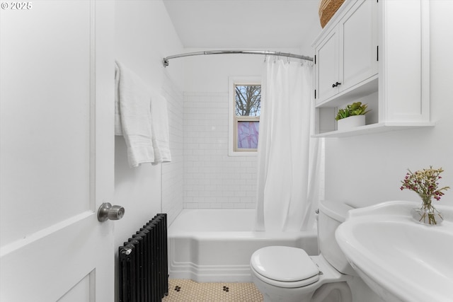 full bath with shower / tub combo with curtain, a sink, toilet, and radiator