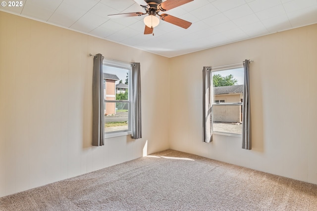 4656 Ocean Beach Hwy, Longview, WA 98632 - spare room featuring plenty of natural light, carpet flooring, and ceiling fan