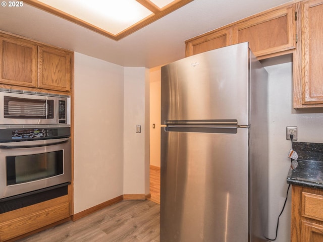 kitchen featuring light hardwood / wood-style floors and stainless steel appliances