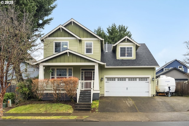 craftsman-style house featuring a garage, a shingled roof, aphalt driveway, covered porch, and board and batten siding