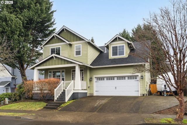 craftsman-style home with driveway, a shingled roof, a porch, and board and batten siding