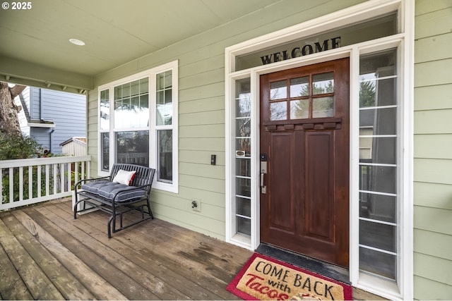 entrance to property featuring covered porch