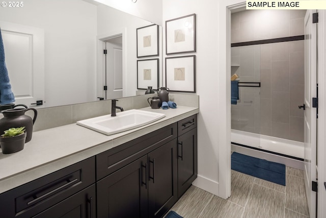 1403 N 41st Pl, Ridgefield, WA 98642 - bathroom with vanity, tiled shower, and baseboards