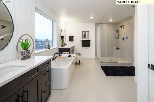 1403 N 41st Pl, Ridgefield, WA 98642 - bathroom with a stall shower, a freestanding bath, vanity, tile patterned floors, and recessed lighting