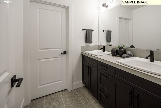 1403 N 41st Pl, Ridgefield, WA 98642 - bathroom featuring double vanity and baseboards