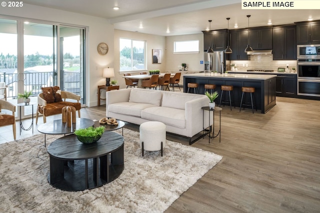 1403 N 41st Pl, Ridgefield, WA 98642 - living area featuring light wood-style floors, recessed lighting, and baseboards