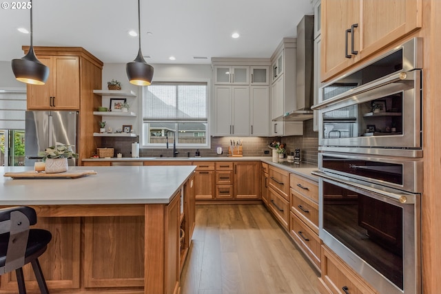 18500 NE 79th St, Vancouver, WA 98682 - kitchen with appliances with stainless steel finishes, healthy amount of natural light, light countertops, light wood-style floors, and recessed lighting