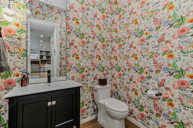 18500 NE 79th St, Vancouver, WA 98682 - bathroom featuring wallpapered walls, vanity, wood finished floors, and recessed lighting