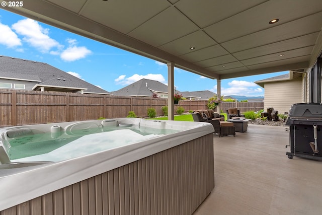 18500 NE 79th St, Vancouver, WA 98682 - fenced backyard with a hot tub, area for grilling, an outdoor hangout area, a patio area, and a residential view