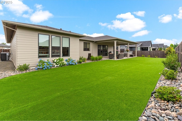 18500 NE 79th St, Vancouver, WA 98682 - back of property with a fenced backyard, a patio, and an outdoor living space