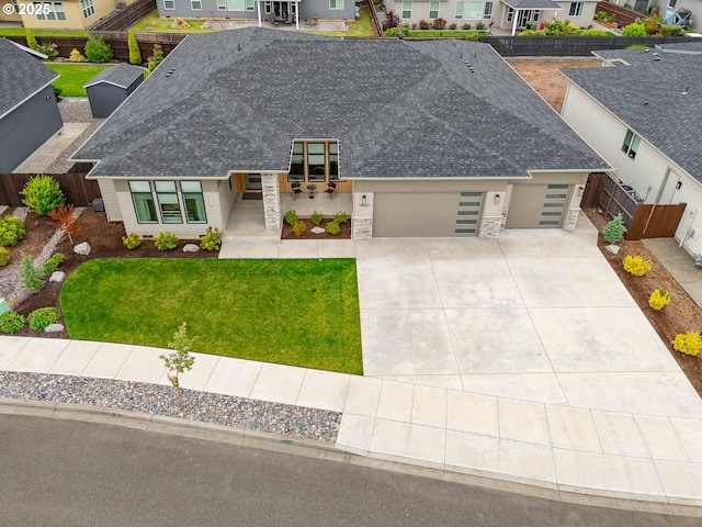 18500 NE 79th St, Vancouver, WA 98682 - view of front of home featuring a garage, roof with shingles, and stone siding