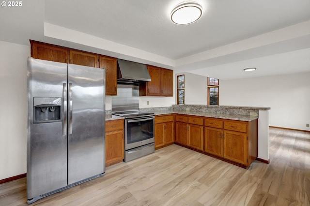 915 Marquet Way, Eugene, OR 97401 - kitchen with stainless steel appliances, wall chimney range hood, light wood-style flooring, a peninsula, and baseboards