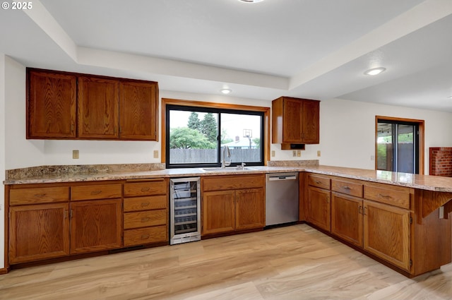 915 Marquet Way, Eugene, OR 97401 - kitchen featuring dishwasher, beverage cooler, a peninsula, a sink, and plenty of natural light