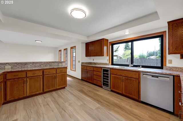 915 Marquet Way, Eugene, OR 97401 - kitchen with dishwasher, a sink, a tray ceiling, wine cooler, and plenty of natural light