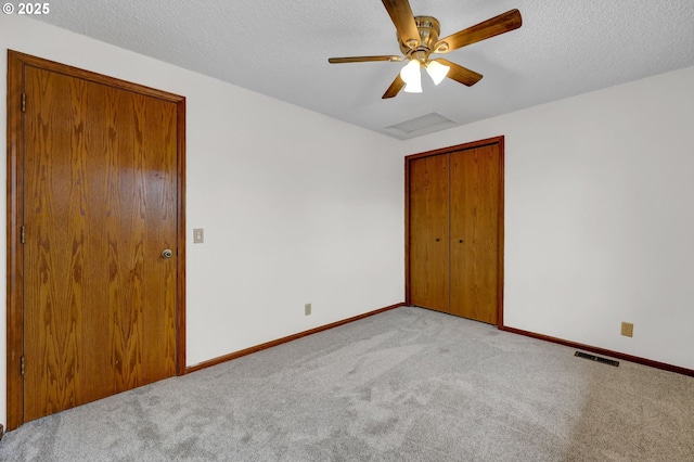915 Marquet Way, Eugene, OR 97401 - unfurnished bedroom featuring carpet floors, baseboards, a closet, a textured ceiling, and ceiling fan