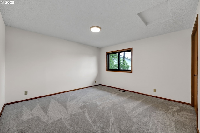 915 Marquet Way, Eugene, OR 97401 - unfurnished room featuring attic access, carpet floors, a textured ceiling, and baseboards
