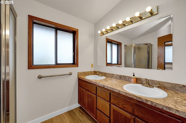915 Marquet Way, Eugene, OR 97401 - full bath featuring double vanity, a shower stall, wood finished floors, and baseboards