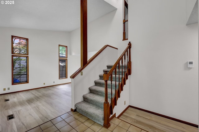 915 Marquet Way, Eugene, OR 97401 - staircase with wood finished floors and baseboards