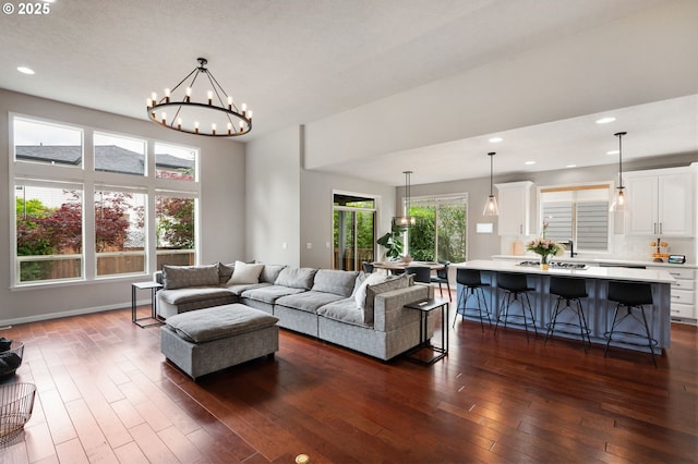 14925 SE Pebble Beach Dr, Happy Valley, OR 97086 - living room with dark wood-type flooring, a chandelier, and recessed lighting