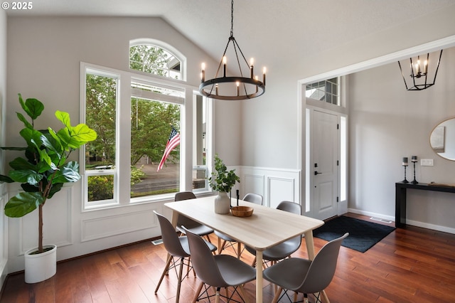 14925 SE Pebble Beach Dr, Happy Valley, OR 97086 - dining room with a chandelier, hardwood / wood-style flooring, lofted ceiling, and a wainscoted wall