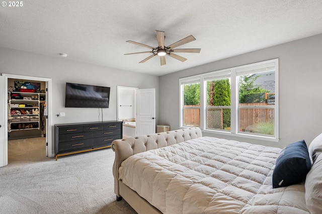 14925 SE Pebble Beach Dr, Happy Valley, OR 97086 - bedroom featuring light carpet, a walk in closet, and a closet