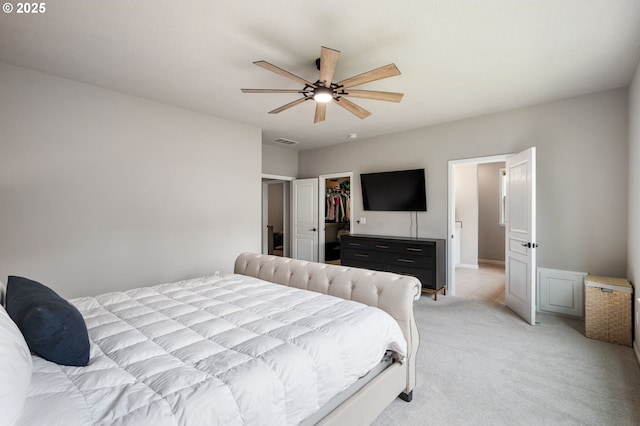 14925 SE Pebble Beach Dr, Happy Valley, OR 97086 - bedroom with light colored carpet, a walk in closet, a ceiling fan, and a closet