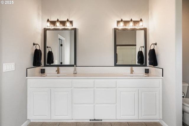 14925 SE Pebble Beach Dr, Happy Valley, OR 97086 - bathroom with toilet, double vanity, tasteful backsplash, and tile patterned floors