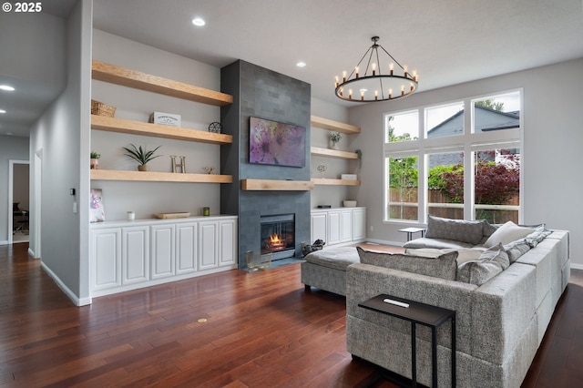 14925 SE Pebble Beach Dr, Happy Valley, OR 97086 - living area featuring dark wood-style flooring, a fireplace, baseboards, a chandelier, and recessed lighting