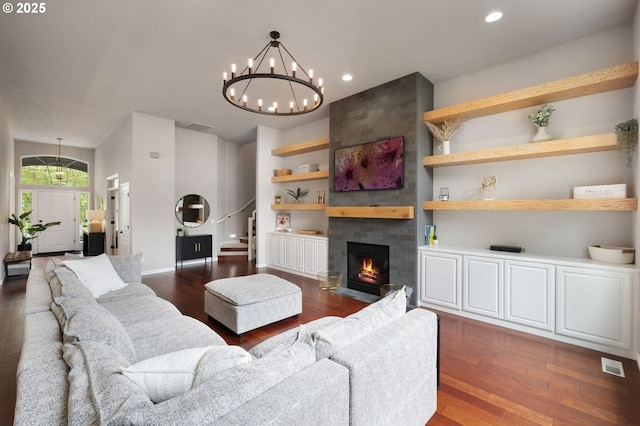14925 SE Pebble Beach Dr, Happy Valley, OR 97086 - living room with dark wood finished floors, stairway, recessed lighting, a chandelier, and a fireplace