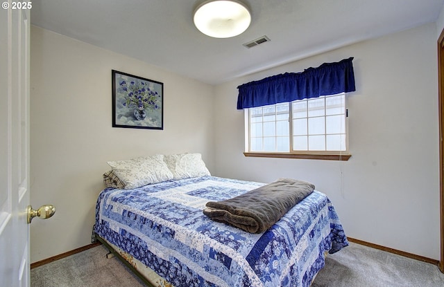 bedroom with visible vents, baseboards, and carpet