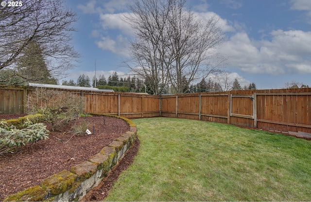 view of yard with a fenced backyard