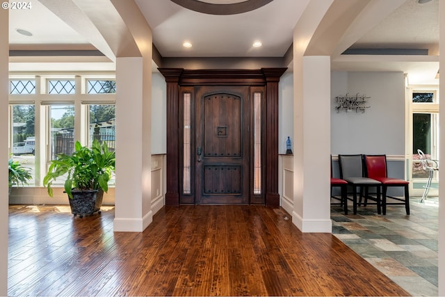 foyer entrance featuring dark hardwood / wood-style floors