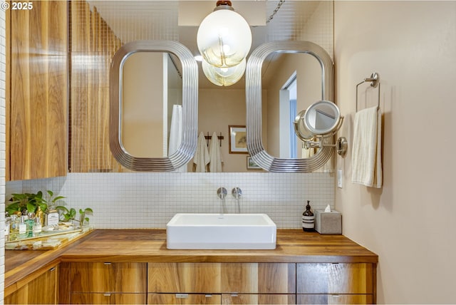 2530 SE 26th Ave Unit 401, Portland, OR 97202 - bathroom featuring tasteful backsplash and vanity