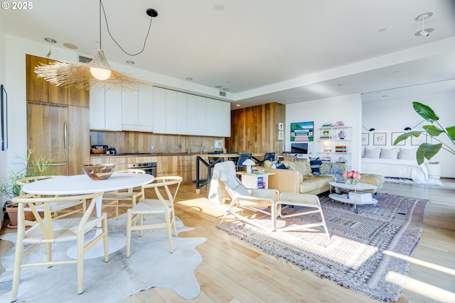 2530 SE 26th Ave Unit 401, Portland, OR 97202 - living area featuring light wood-style flooring and recessed lighting