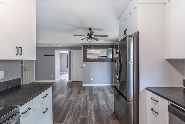 10522 SE Liebe St, Portland, OR 97266 - kitchen featuring appliances with stainless steel finishes, a ceiling fan, white cabinetry, dark wood-type flooring, and dark countertops