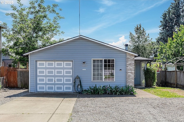 10522 SE Liebe St, Portland, OR 97266 - view of front facade with concrete driveway and an attached garage